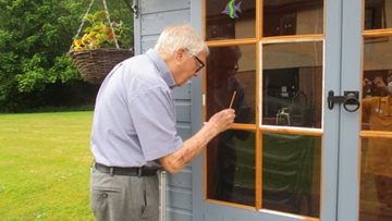 Perth care home Resident helps paint new summer house